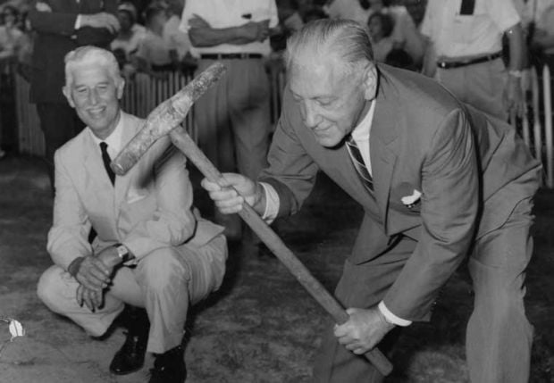 Zoo officials pound in the golden spike for railroad in 1963
